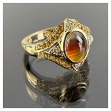 14K Gold Ring featuring a Reddish-orange Gemstone.
