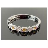 10K Gold Ring featuring Clear an Yellow Gemstones.