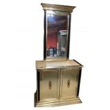 Gold toned bar cabinet with mirror