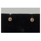 Pair 14k gold earrings, one missing stopper. 0.35