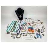 Costume Jewelry: Rhinestone bracelet, pom pom