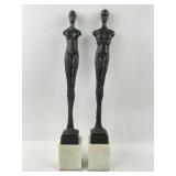 Pair brutalist bronze statues on marble bases.