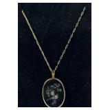 15k gold necklace with black glass bird motif