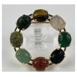 Sterling silver & carved gemstone scarab brooch.