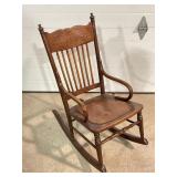 Carved wood childï¿½s rocking chair