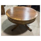 Round wood coffee table with drawer