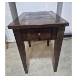 Nightstand In A Dark Brown Wood Finish With A