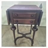 Dark Wood Drop-Leaf Side Table Featuring Turned