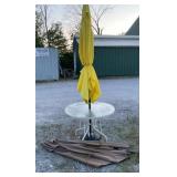 Circle patio table, 2 umbrellas, weighted base