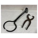 Two iron tongs