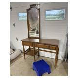 Wood desk, framed mirror, plastic stool