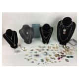 Costume Jewelry: Gold tone chains, Avon earrings,