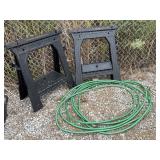 2 Performax folding plastic sawhorses, garden hose