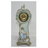 Porcelain clock with lady and birds, 11"