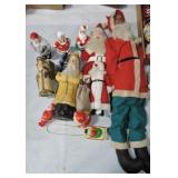Lot of Santa Claus figures, dolls, and ornaments