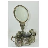 Silver gilted shaving mirror with embossed base,