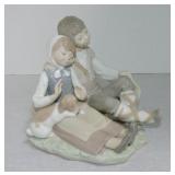 Lladro figure of boy and girl with puppy, 6"