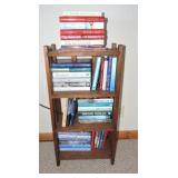 Wooden bookshelf with books: