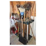 Tool rack with assorted long handled tools