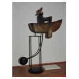 Man in boat swing decor