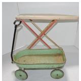 Child's tin ironing board and metal wagon