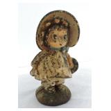 Cast iron girl with bonnet bank, 7 1/2'