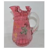 Cranberry floral enameld pitcher, 10'