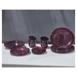 4 place setting Red Glass Dishes: cups, saucers,