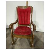Wooden rocker & red cushions