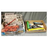 Toy train cars and engines and barn/building