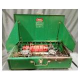 Two burner green Coleman camp stove