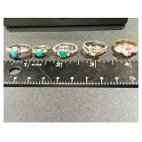 5 sterling silver rings one is gold over 925 .