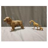 Two brass giraffes in a cast Irish setter