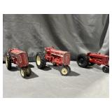 (2) ERTL die cast international tractors & (1)