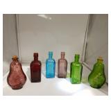 Six vintage colored glass Wheaton glass bottles