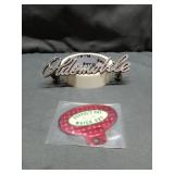 Vtg Oldsmobile trim lettering alongside a vintage