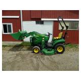 John Deere 1023E tractor with bucket and mower