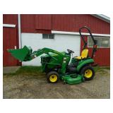 John Deere 1023E tractor with bucket and mower