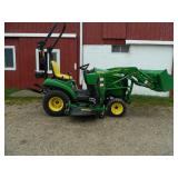 John Deere 1023E tractor with bucket and mower