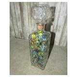 DECANTER FILLED W/ MARBLES