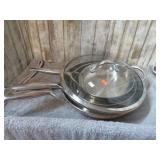 THREE STAINLESS STEEL SKILLETS