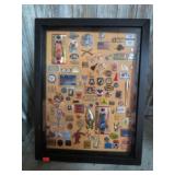 ASSORTED SOUVENIR PINS IN DISPLAY