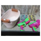 BASKET W/ PUZZLES & N ERF DART GUNS