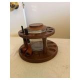 Vintage wooden pipe rack stand with a lidded glass humidor/tobacco jar.