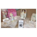 Precious Moments Porcelain Items: 4 - "For the Sweetest Tu-Lip in Town" 1997, "You Are the Wind Beneath My Wings"2000, "It is no Secret What God can Do"1994, & "Sugar Town - Leo & Evelyn Mae" 1994 - A