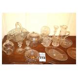 Variety of Glass Serving Pieces -  Glass Basket, Plates, Apple Container, Lidded Dish Pitcher Lidded Bowls, Candle Sticks, Creamer, Sugar Bowl (handle broken)