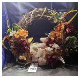 Grape Vine with Tan / Cream Bow has the feathers and orange  flowers