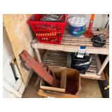 Shelf with Automotive Catalogues, DampRid, and Wooden Toy Truck