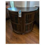 Bookcase or Cabinet with a Faux Book Facade.