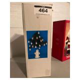 Snowman Holding a Christmas Tree with Decorations